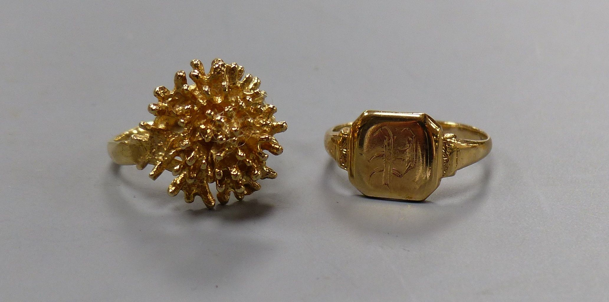 A modernist 9ct yellow gold formed as a coral branch cluster and a 9ct yellow gold signet ring 6.3g